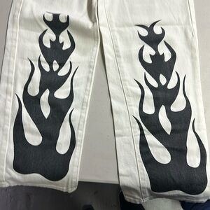 White jeans fire print black design on bottom front legs